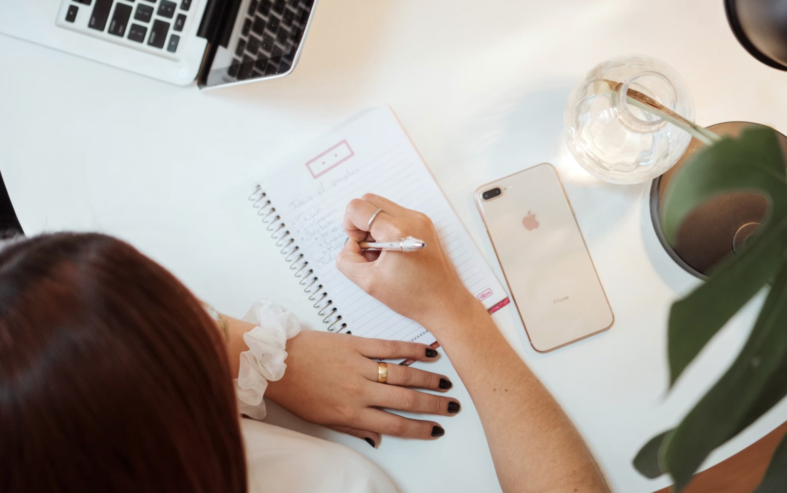 A user rewriting a psychic reading question at a desk
