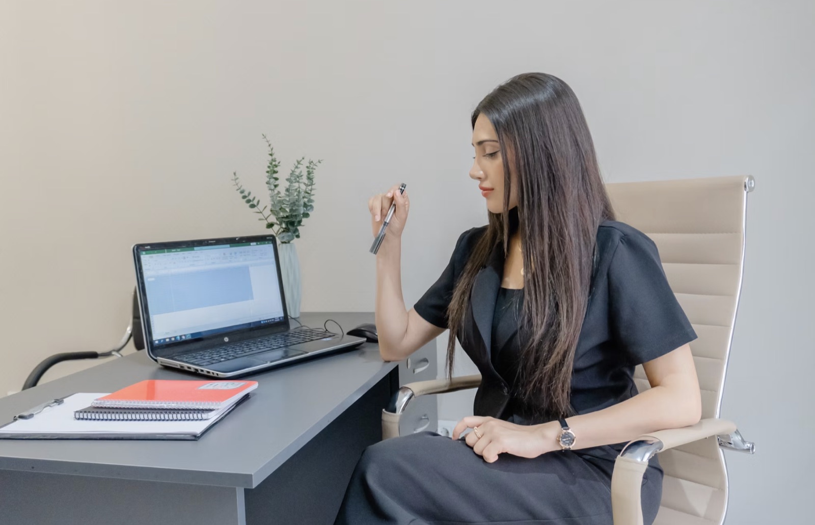 A professional reflecting on a career decision at a desk