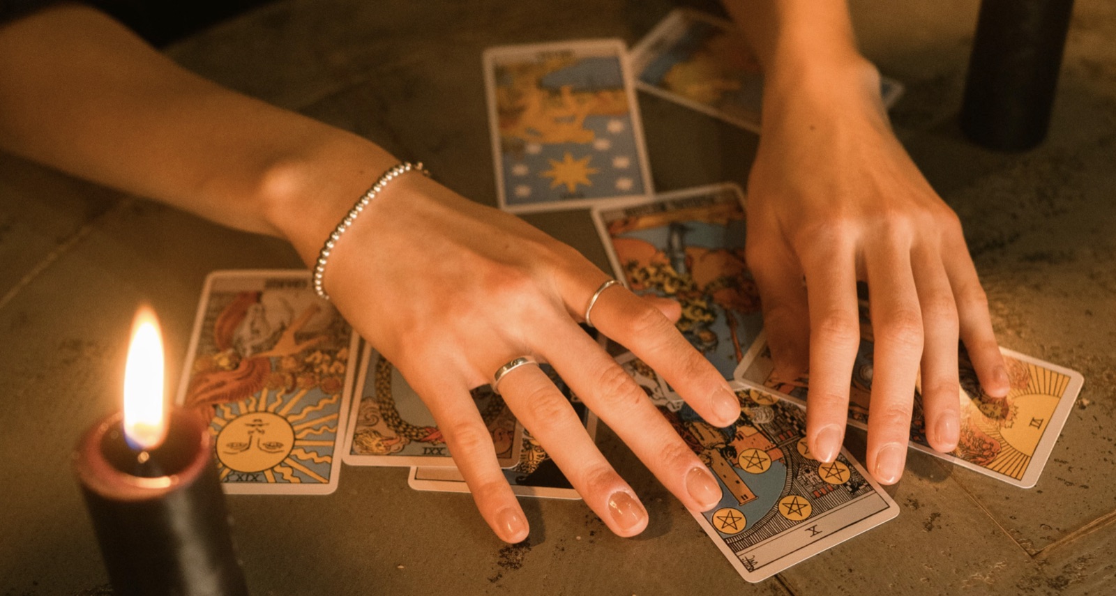 A tarot layout arranged with clear structure to represent a ten-card reading.