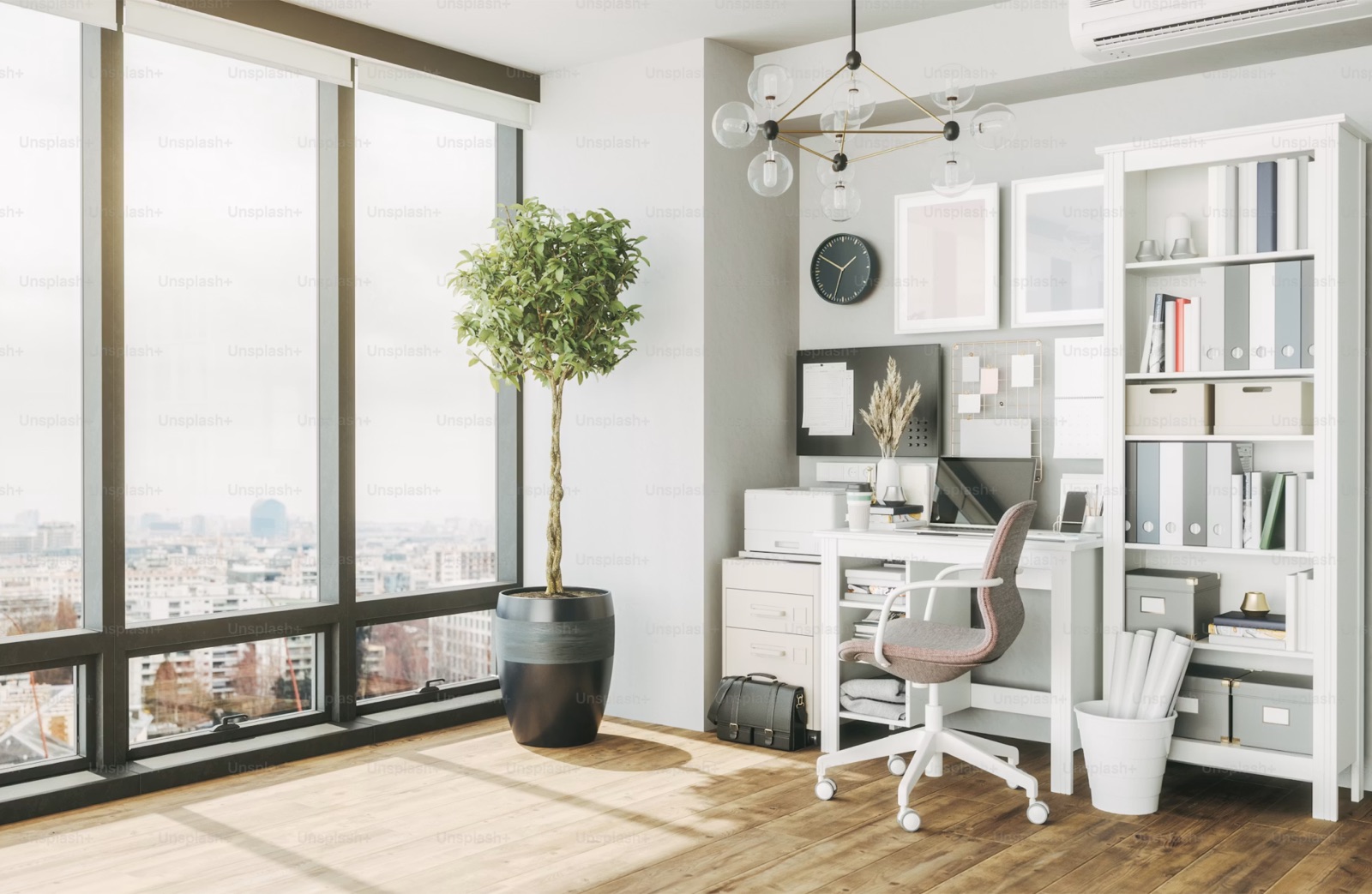 Sunlight falling across a desk and notebook by a window.
