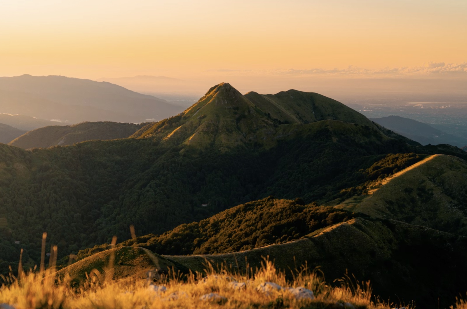Sunlit mountain ridges at golden hour.