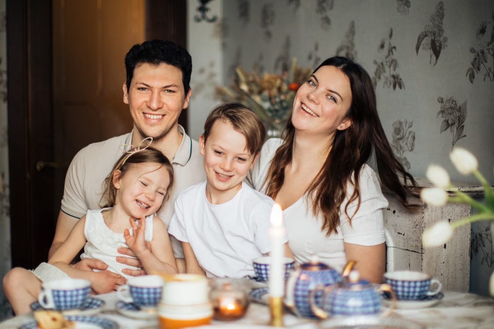 A real family sharing a warm meal together, reflecting emotional fulfillment, togetherness, and harmony.