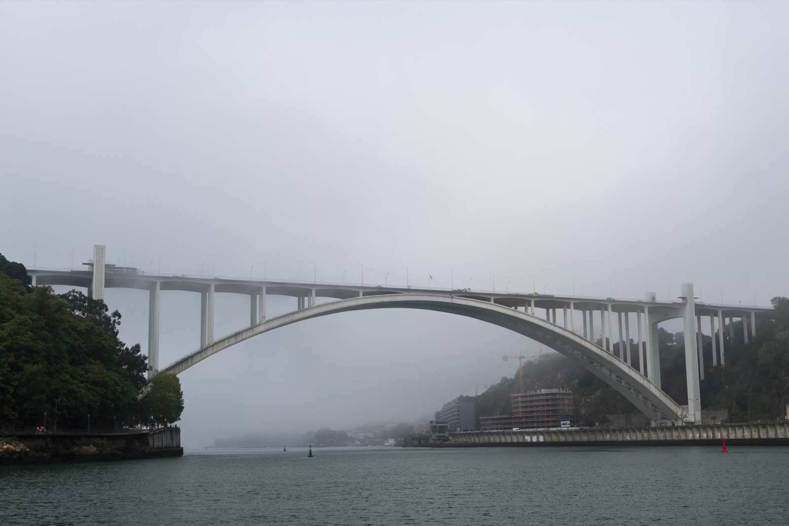 A bridge fading into mist, symbolizing an uncertain path toward reconnection and repair.