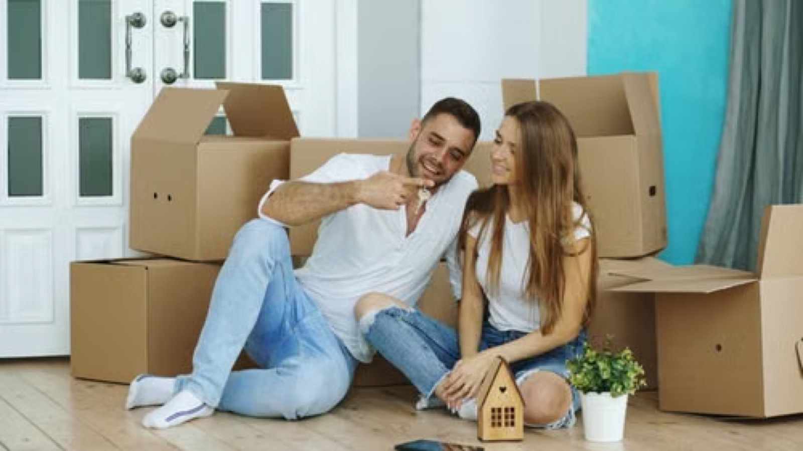 A couple preparing for a shared future, such as moving into a new home or planning a life together.