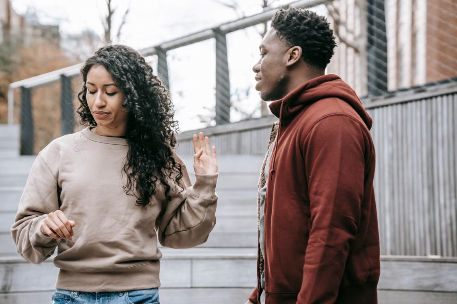 A couple in a serious conversation, reflecting the need for honesty, definition, and clearer expectations in a relationship.