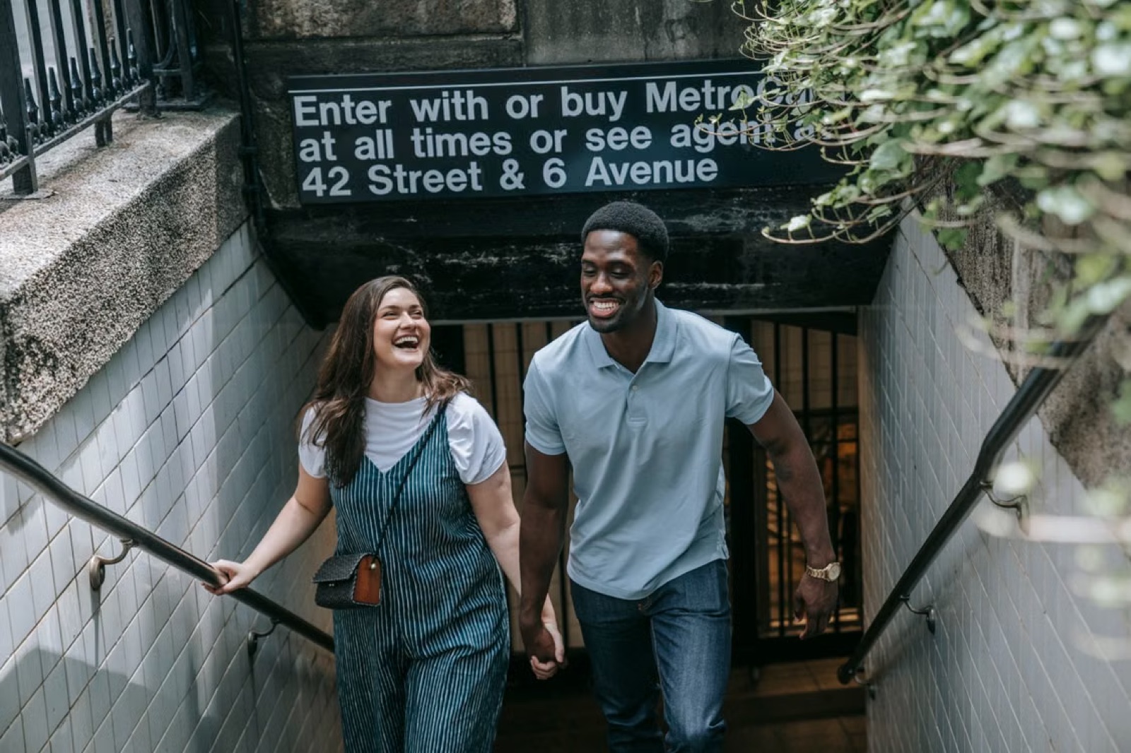 A couple moving through a subway or station environment, capturing the speed, excitement, and forward pull of a new connection.