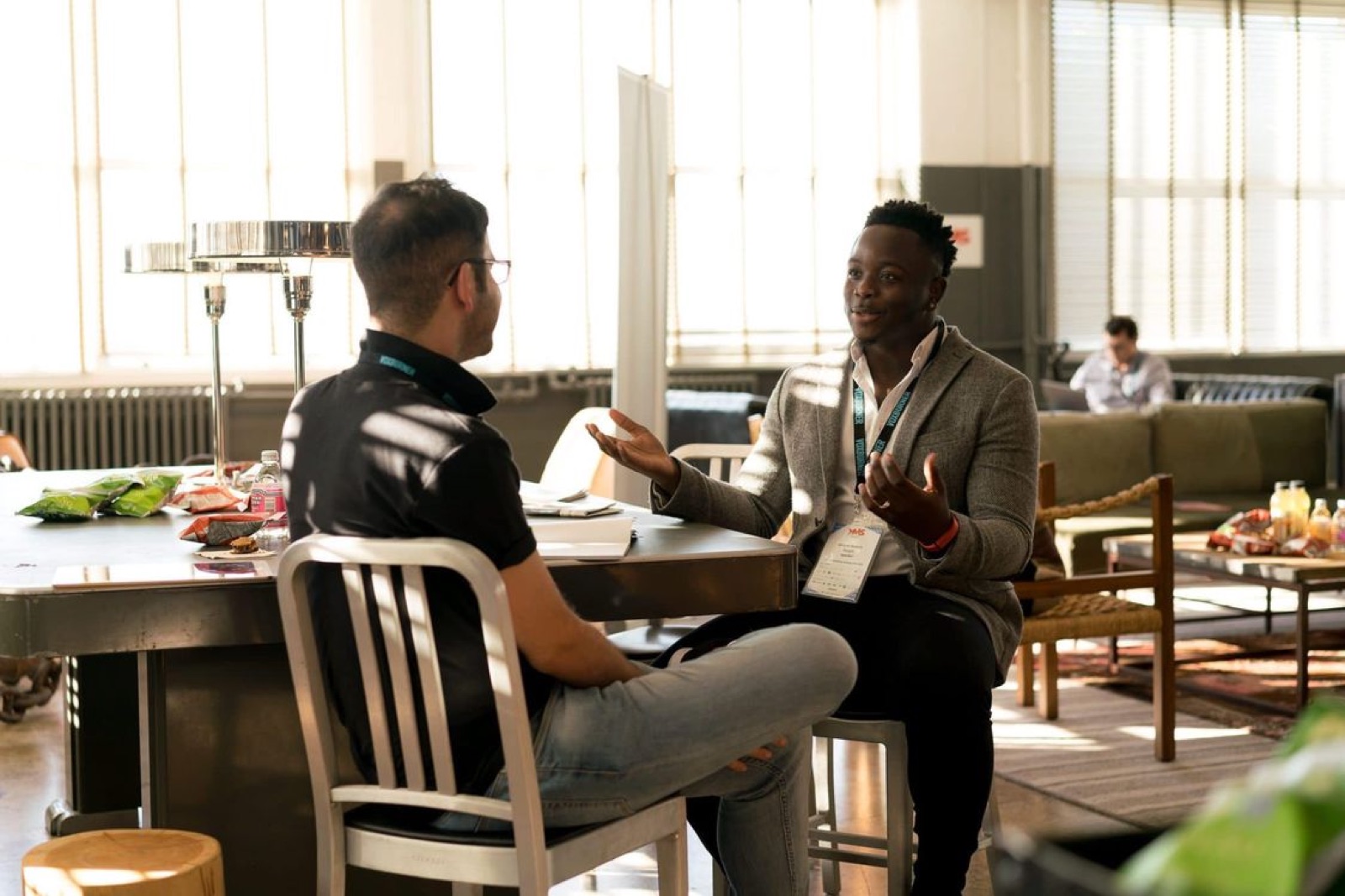 A mentor and a student having a calm conversation in a quiet room