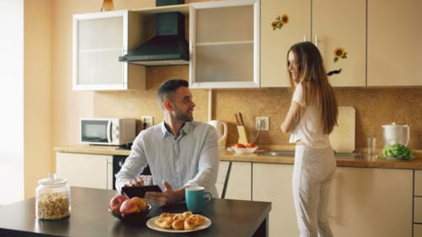 A couple having a serious conversation at home after a yes or no tarot reading