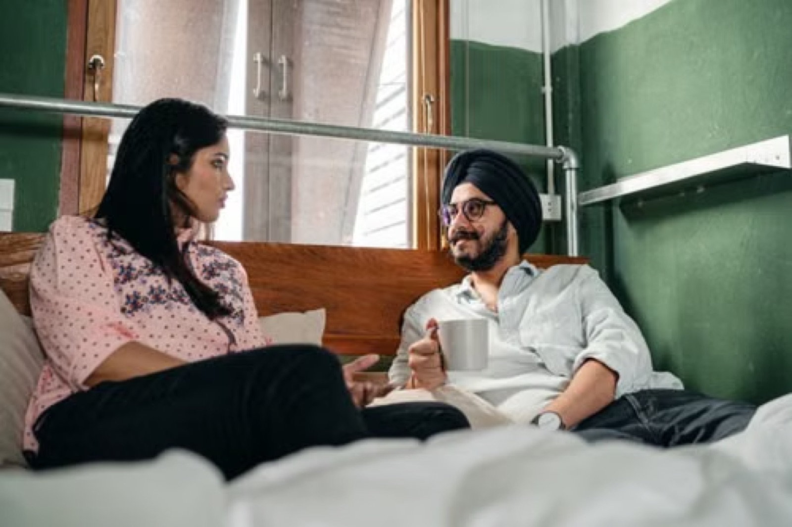 A couple in a quiet, calm setting rebuilding trust after a difficult period, with honest, gentle body language.