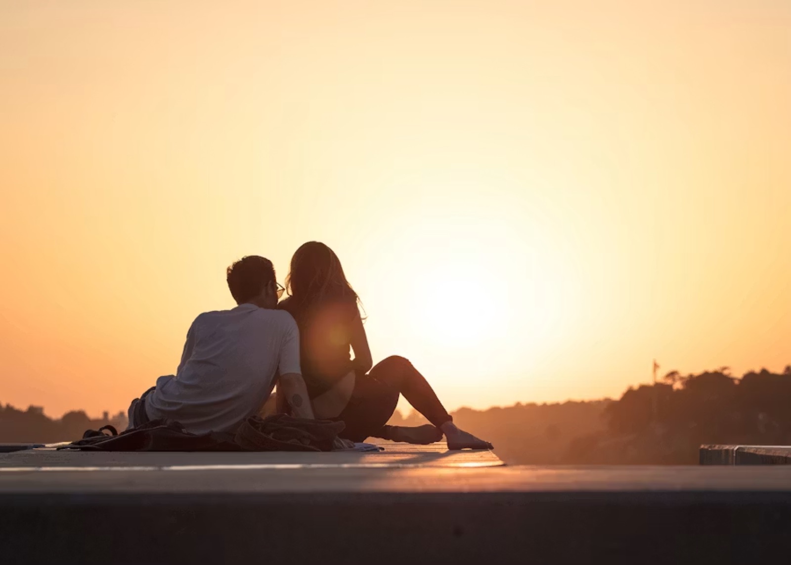 Two people walking into the distance or standing within a full-circle scene—archway, horizon, or open landscape—that suggests completion, shared future, and having arrived together.